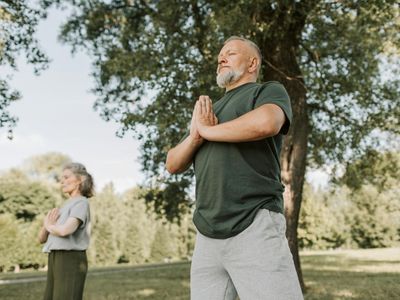 Person practicing deep breathing exercises in a quiet space.